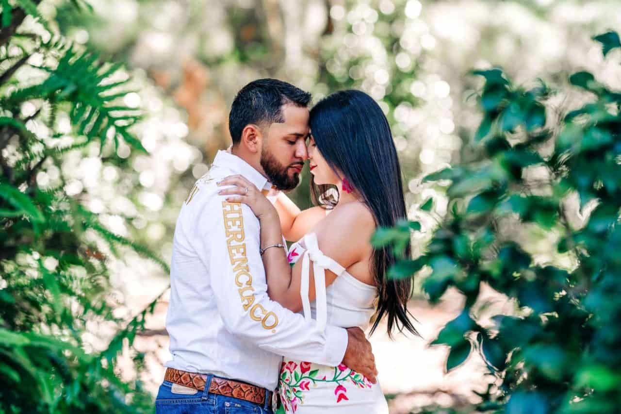 Couple kissing and having fun at one of the many engagement photography locations at Bok Tower Gardens located near Lakeland FL