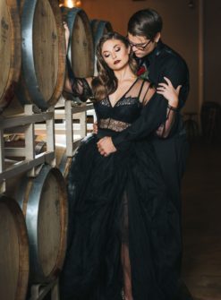 Black is in! Check out this beautiful wedding couple standing next to some oak barrels at an Orlando area wedding venue. Central Florida Wedding Photographer