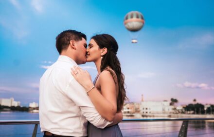 Tatianna & Oritos Engagement Session Disney Springs A couple embracing together during an engagement photography session.